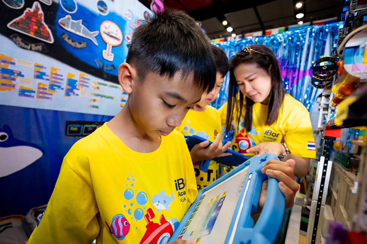 A FIRST LEGO League student programming their robot at FIRST Championship.