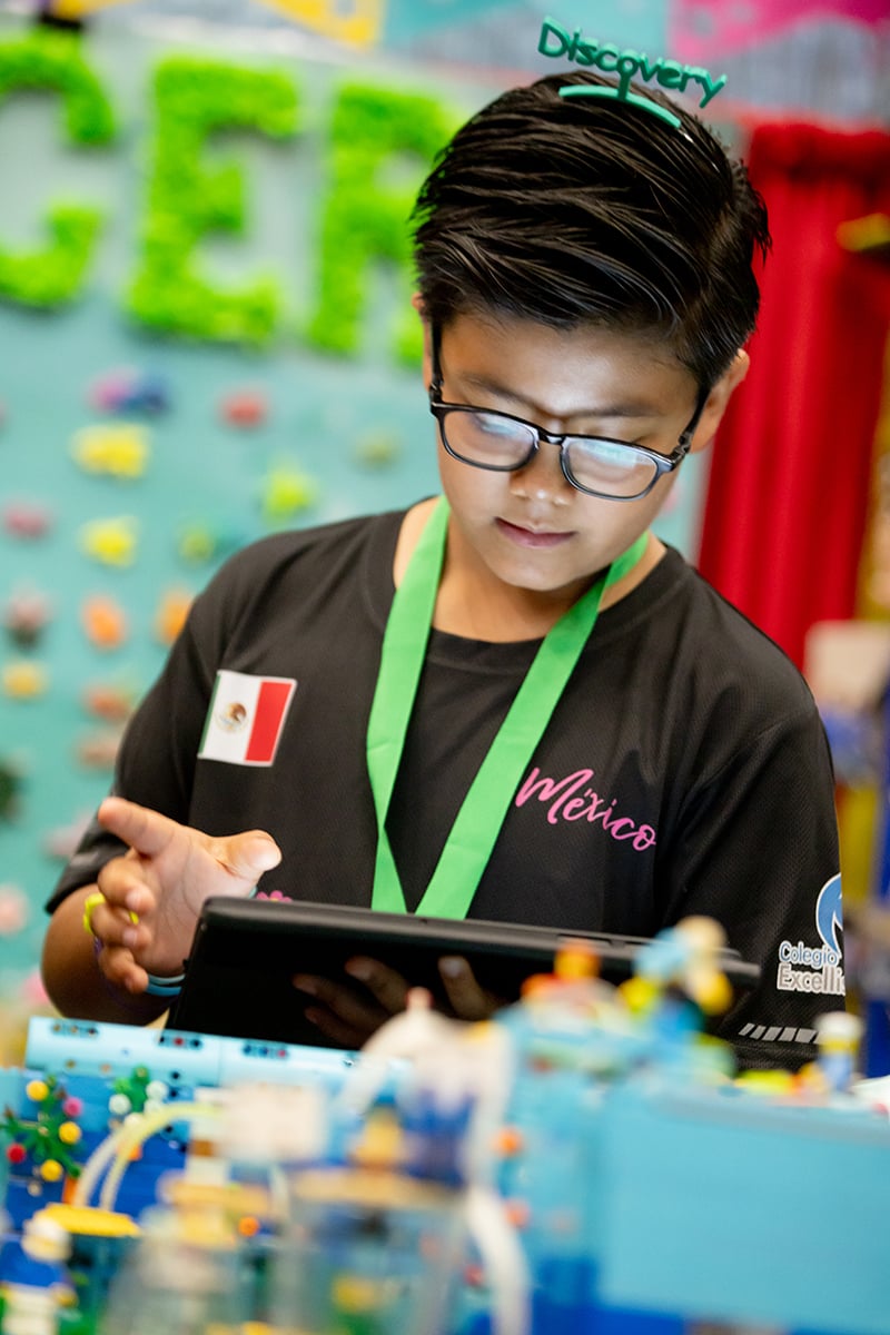 FIRST LEGO League student programming their robot at FIRST Championship.