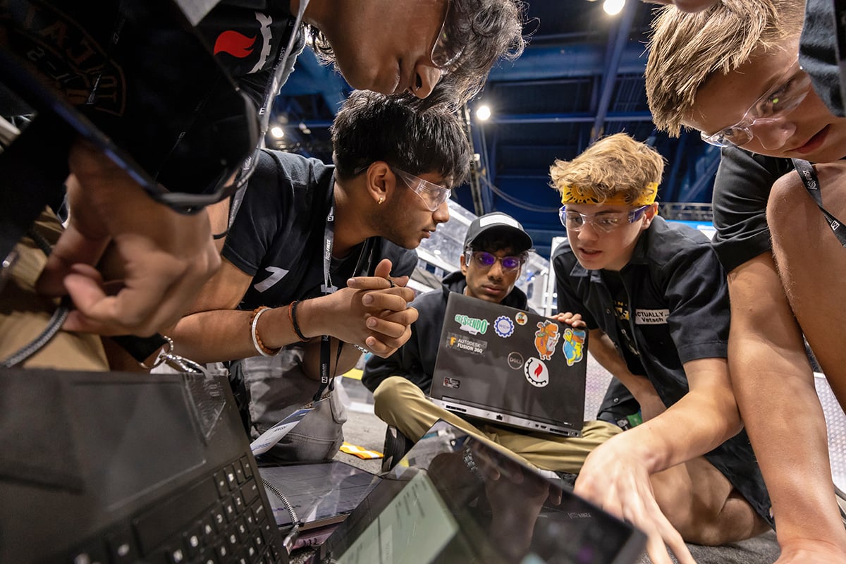Two FIRST Robotics Competition teams discussing strategy at FIRST Championship